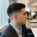 Side profile of a professional man with a clean taper fade haircut suitable for office and daily wear.
